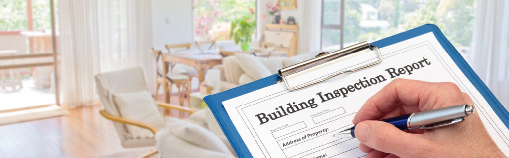 Buiding Inspector completing an inspection form on clipboard inside living room